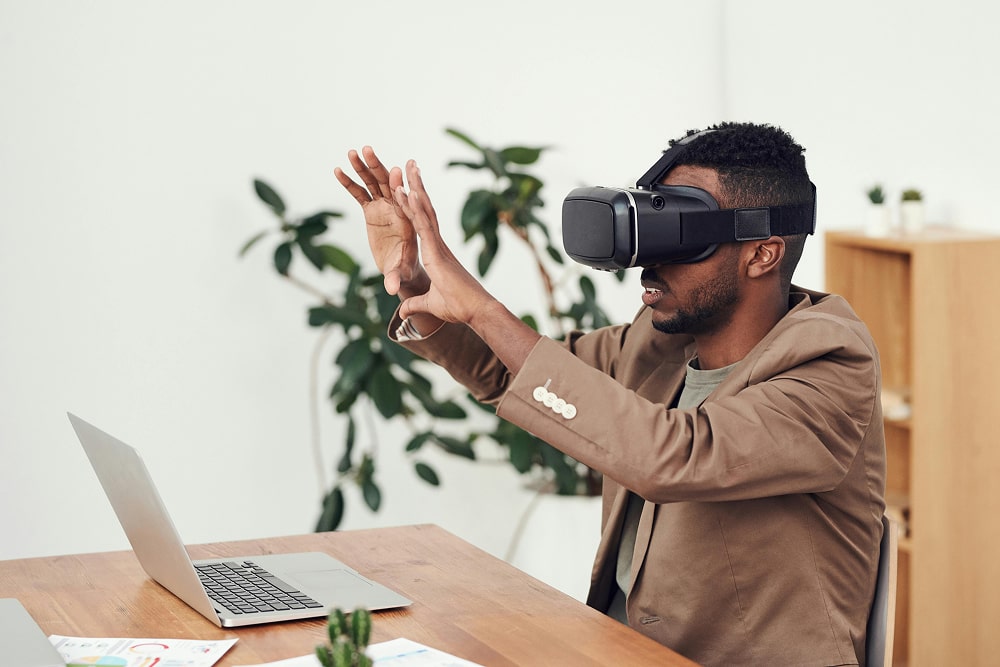 Man Using VR Goggles to browse the internet and shop.