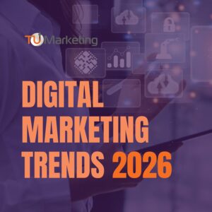 TU Marketing graphic “Marketing Trends 2026”. Background of person holding a tablet with digital marketing icons and analytics overlays, highlighting trends and innovation for 2026.”